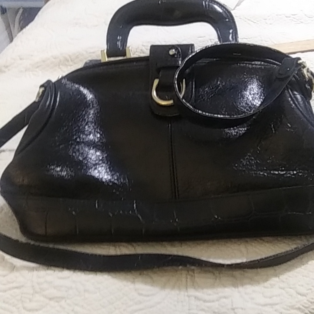 Vintage 1980 woman patent leather black with gold hard ware footed bottom satche